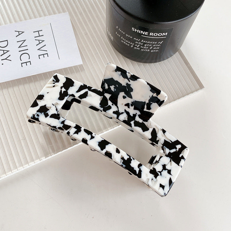 Wholesale Cow Black and White Medium Hollow Acetate Plate Hair Clips